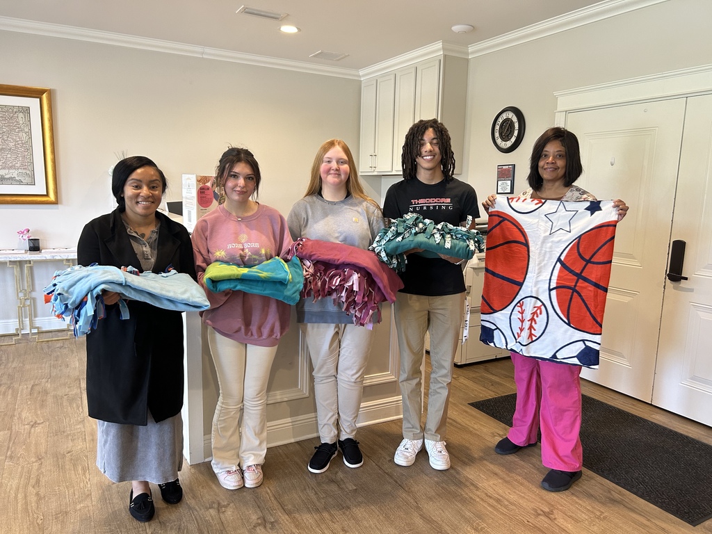 Key Club and Teen Science Cafe deliver handmade blankets to the Ronald McDonald House!