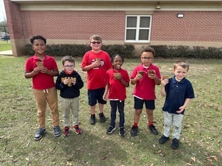 Ms. Thorntons First Grade engaged in a hands-on two month science project, planting zinnia seeds in March and repotting them today. This activity helped the students understand the plant life cycle, plant parts, and needs, nurturing patience and stewardship. 