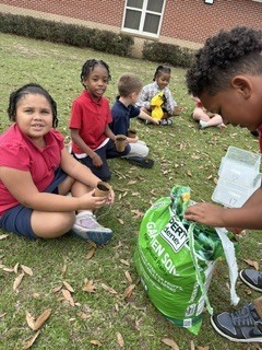 Ms. Thorntons First Grade engaged in a hands-on two month science project, planting zinnia seeds in March and repotting them today. This activity helped the students understand the plant life cycle, plant parts, and needs, nurturing patience and stewardship. 