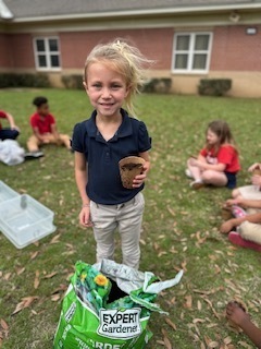 Ms. Thorntons First Grade engaged in a hands-on two month science project, planting zinnia seeds in March and repotting them today. This activity helped the students understand the plant life cycle, plant parts, and needs, nurturing patience and stewardship. 