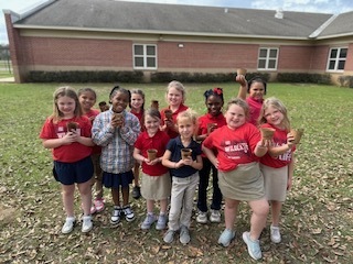 Ms. Thorntons First Grade engaged in a hands-on two month science project, planting zinnia seeds in March and repotting them today. This activity helped the students understand the plant life cycle, plant parts, and needs, nurturing patience and stewardship. 