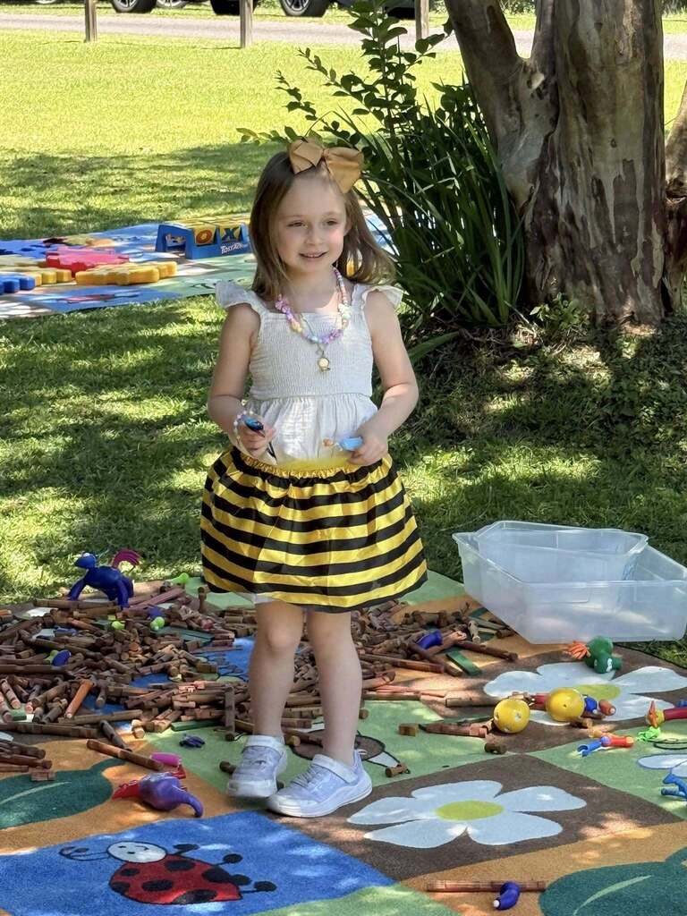 A girl in a bumblebee outfit