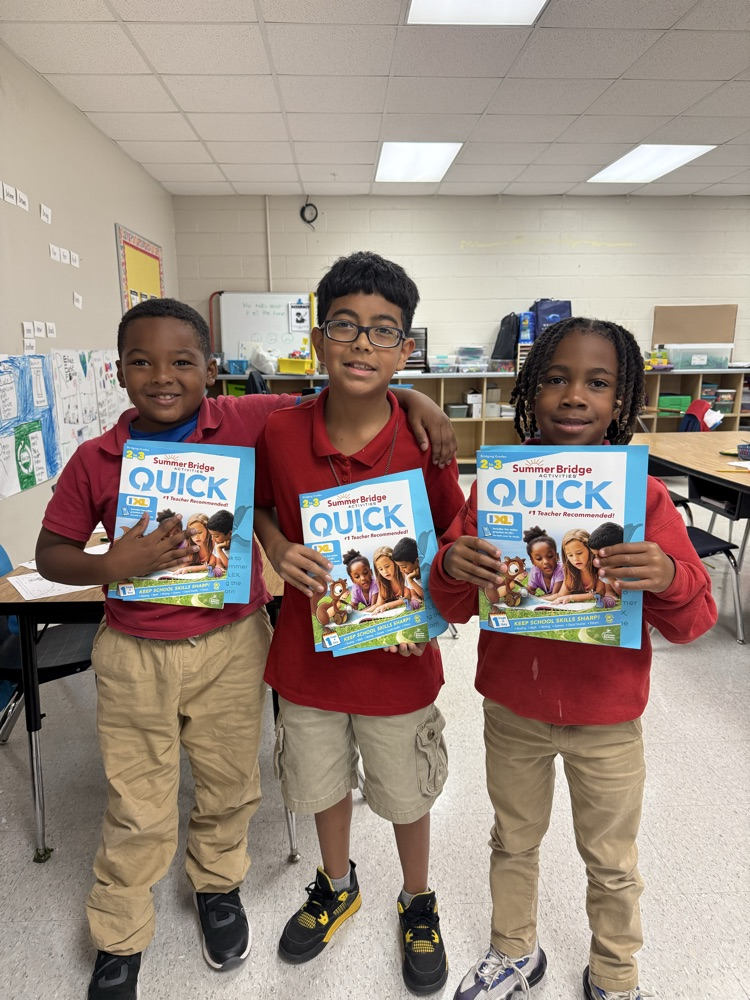 Second grade with their summer workbook