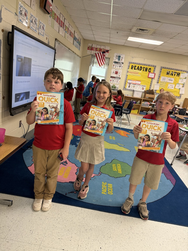 third grade with their summer workbook