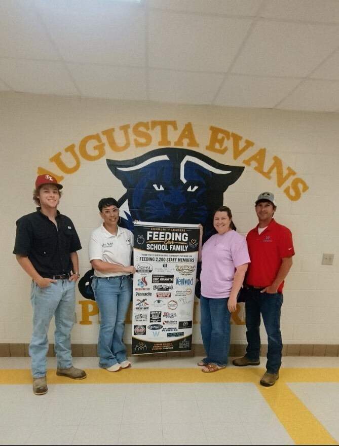 Group photo with Mrs. Kidd and the community sponsors who brought the breakfast for the Evans staff 