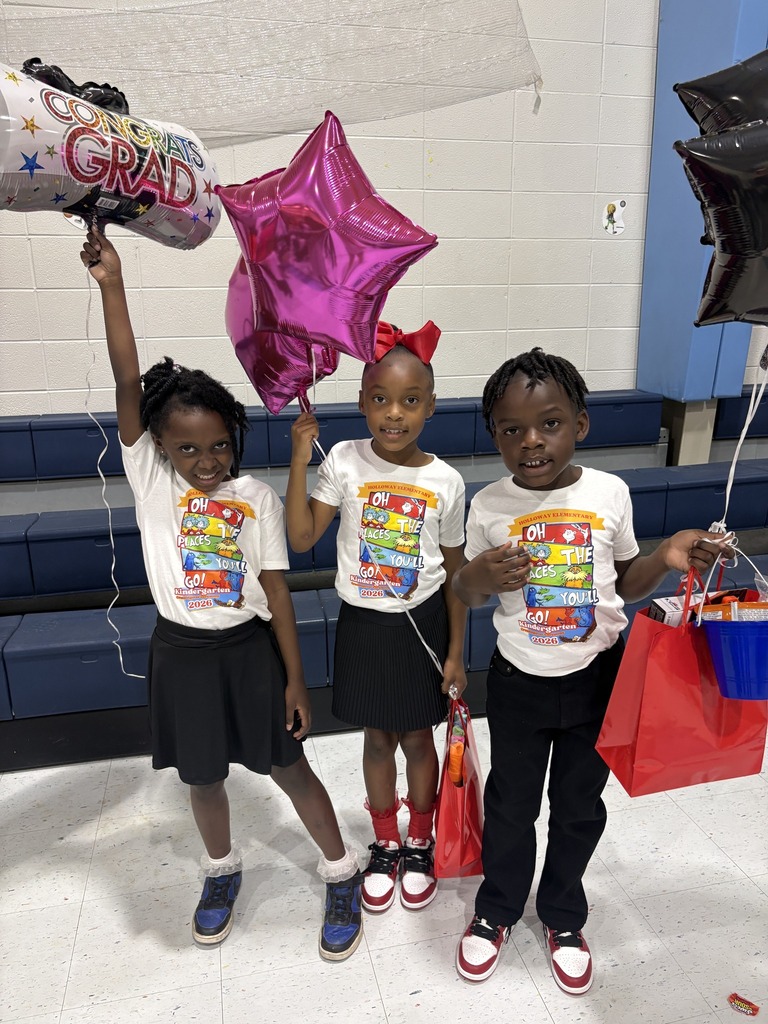 Three kindergarten students holding balloons