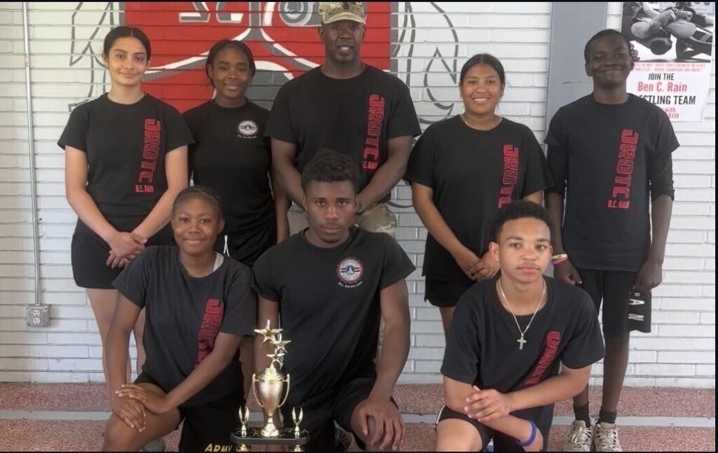 B.C. Rain JROTC cadets, with a trophy