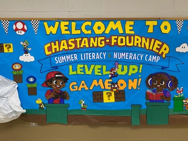 A bulletin board welcoming students to the Chastang-Fournier Summer Literacy and Numeracy Camp