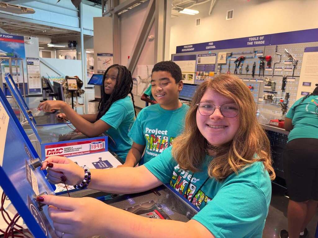 Three Scarborough students playing with equipment at Flight Works Alabama