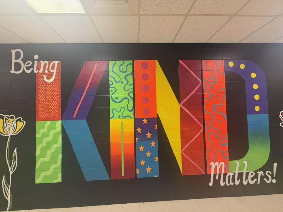 A colorful mural with the words "Being Kind Matters!"