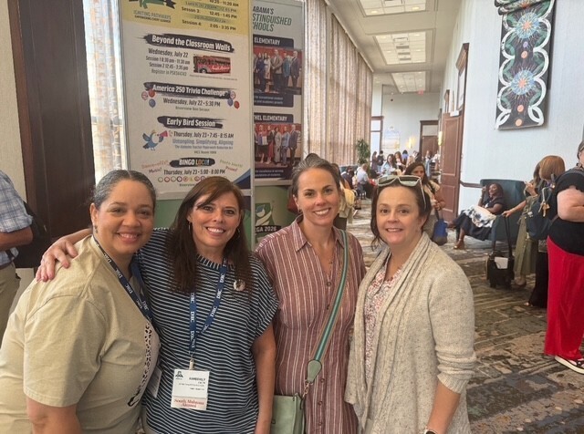 Four teachers at the Mega Conference