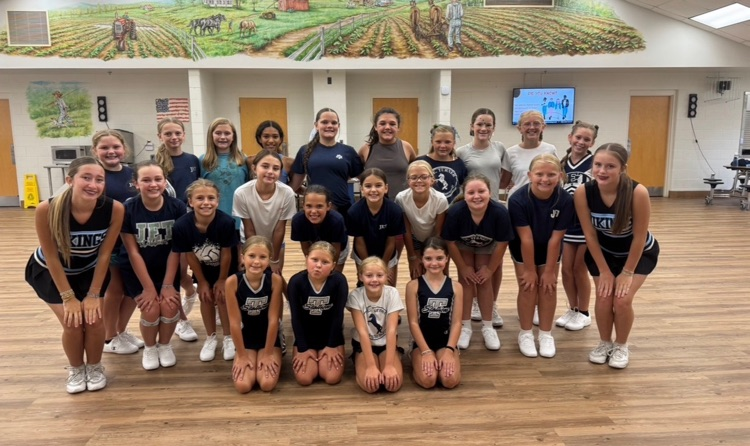 JE turner and mgm cheerleaders for a group photo 