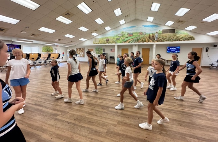 girls practicing cheer routine 