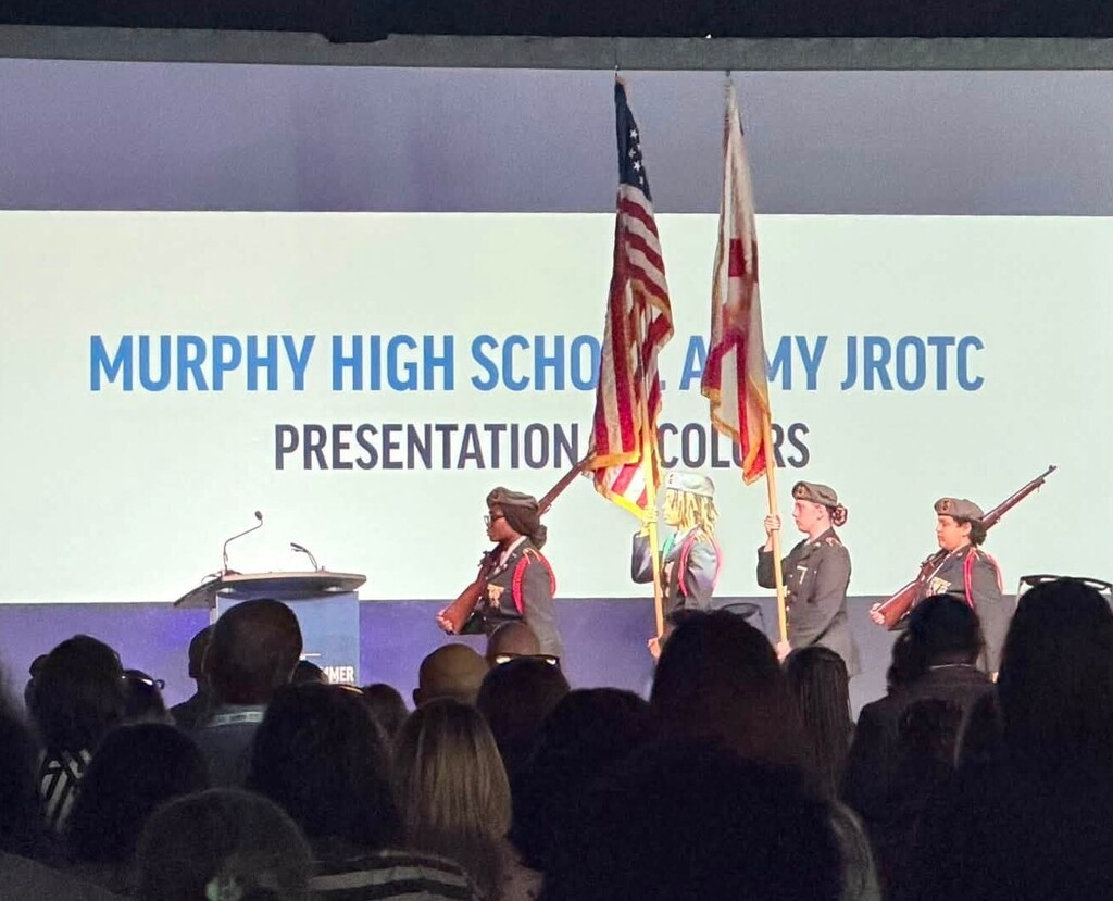 The Murphy High School JROTC color guard presents the U.S. and Alabama flags