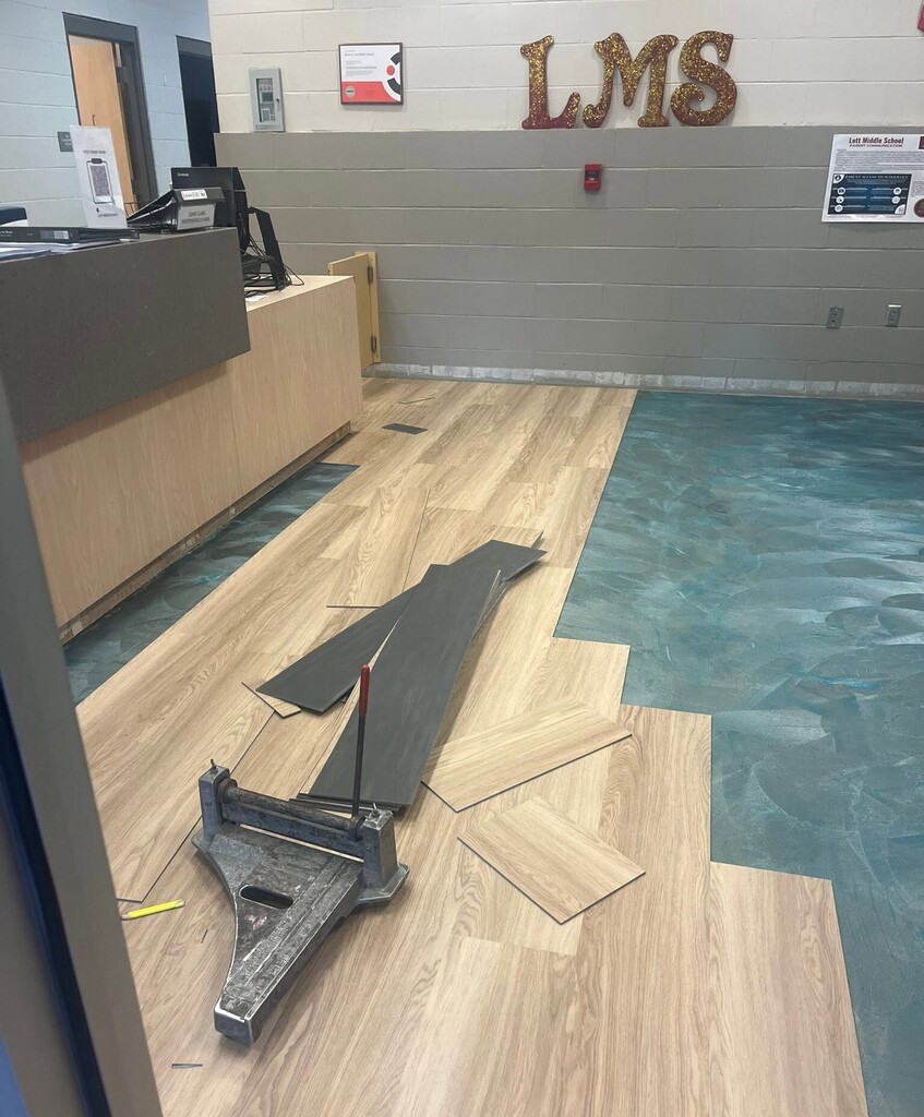New flooring being installed in a school lobby