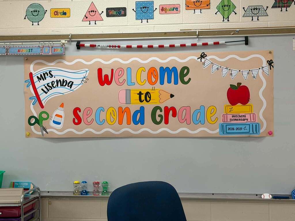 A banner on a white board that reads "Welcome to Second Grade"
