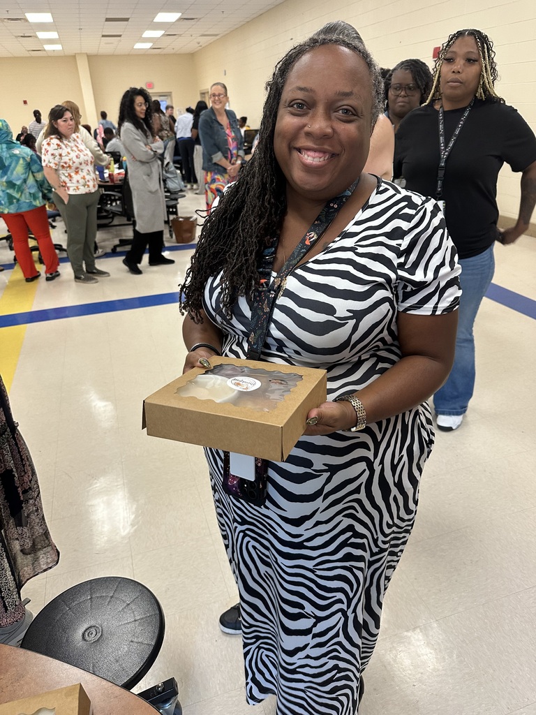 Augusta Evans Staff member holding her brunch box provided by Mrs. Kidd and the breakfast spot