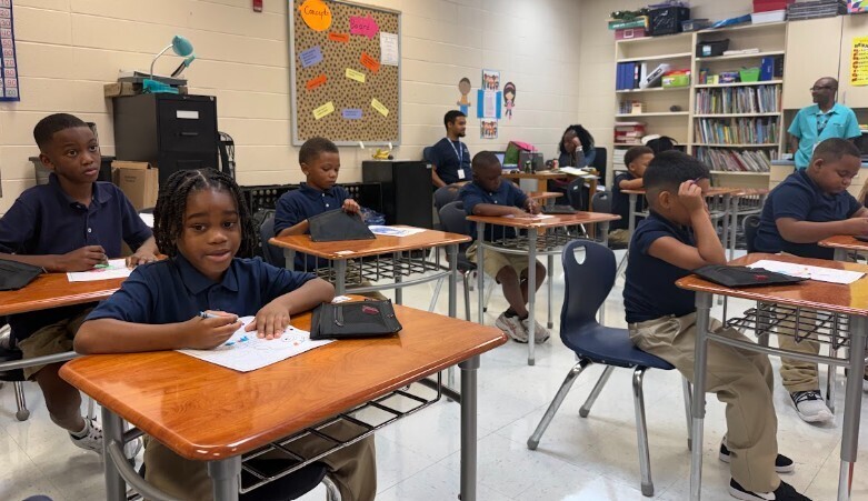 Several students sitting attentively in the classroom