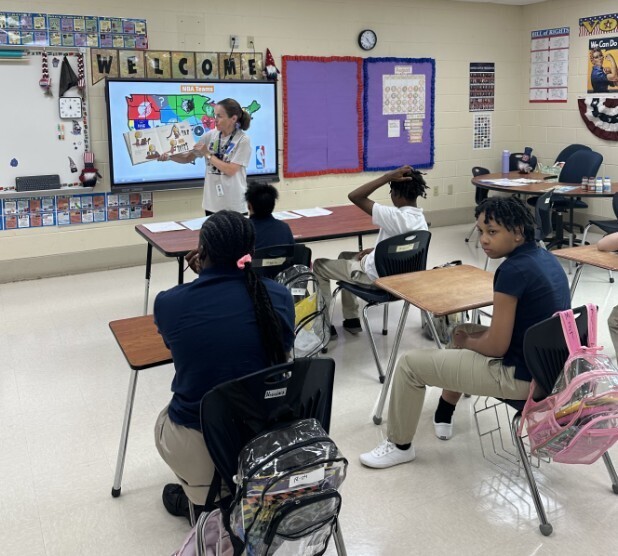 Cougar level teacher reading to her class on the first day of school