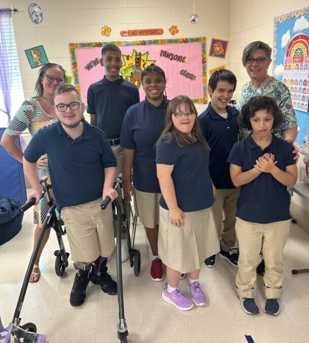 Cougar level class all smiling in a group photo for the first day of school