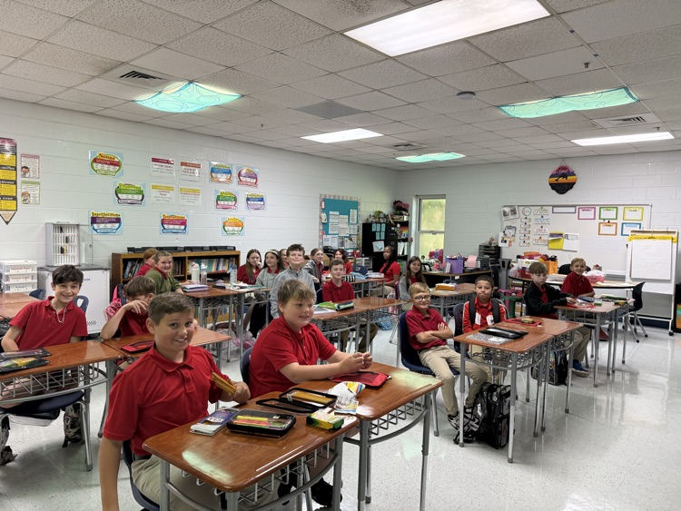 miss Crawford‘s fifth grade class students sitting at their desks