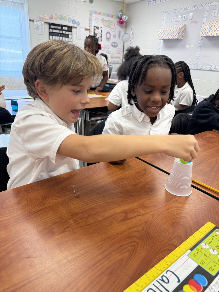 Two students working together to save Sammy