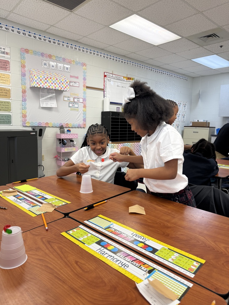 Two students working together to save Sammy