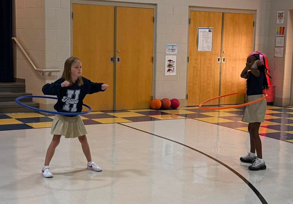 Two girls hula-hooping
