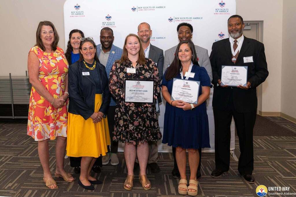 Several educators holding certificates