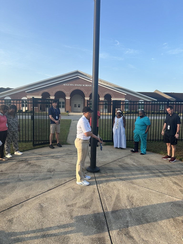 Monday morning word of encouragement with Mrs. Kidd in front of the school by the flagpole