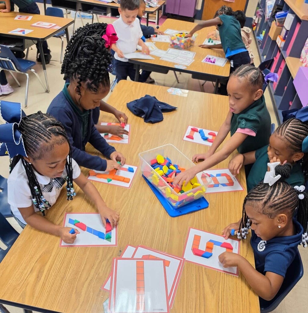 Students using shapes to make numbers