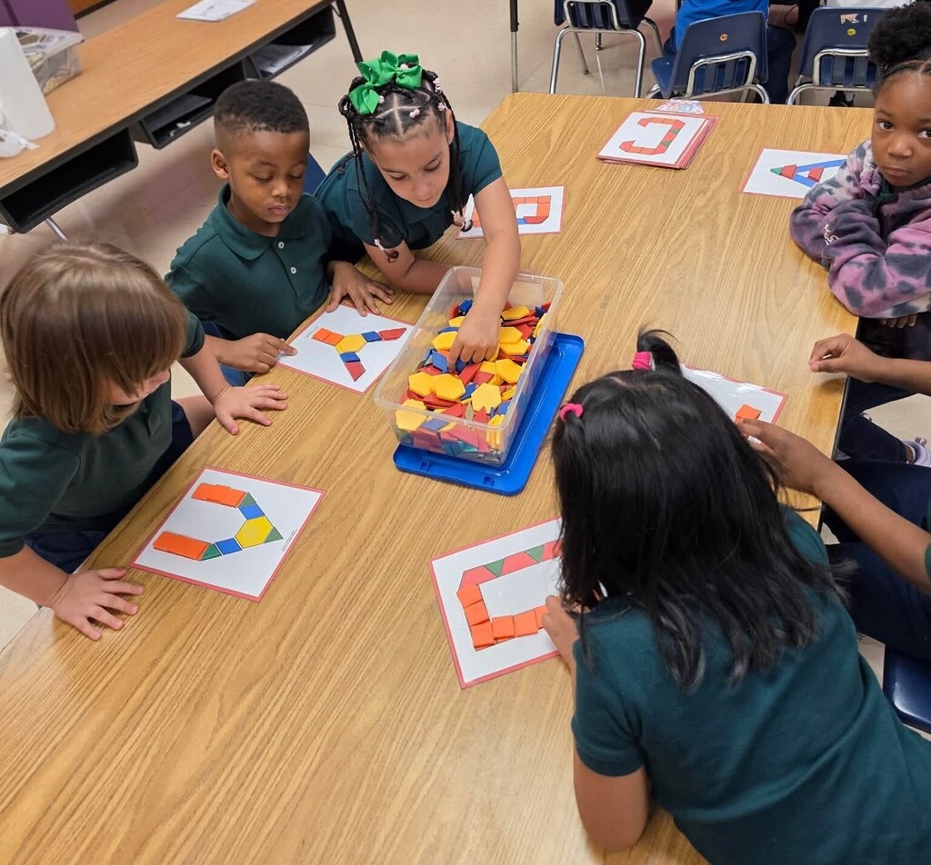 Students using shapes to make letters