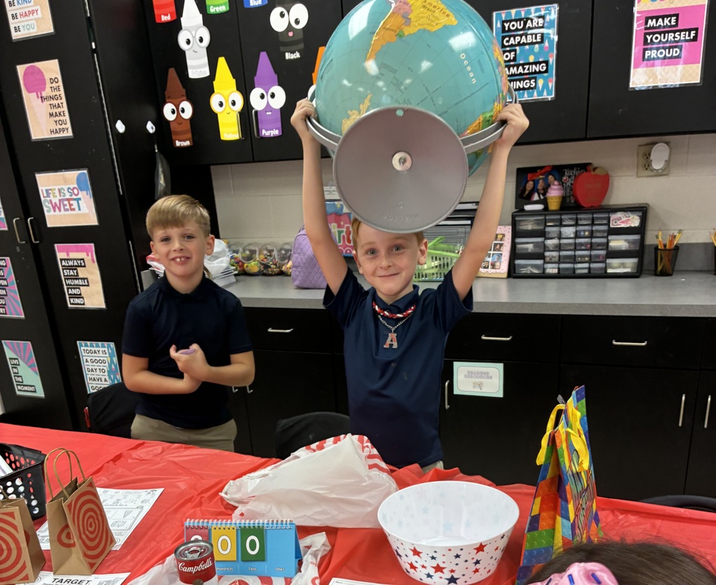 Our little Wildcats in Mrs. Qualls second grade class had a Target-inspired day of 3-D shape fun! ❤️🎯🛒 Students went on a shape hunt, explored real-world 3-D objects, and practiced identifying and describing their attributes using their new vocabulary: faces, edges, and vertices! 🧵🌍🎲 Learning is always more fun when it is hands-on play! 🐾