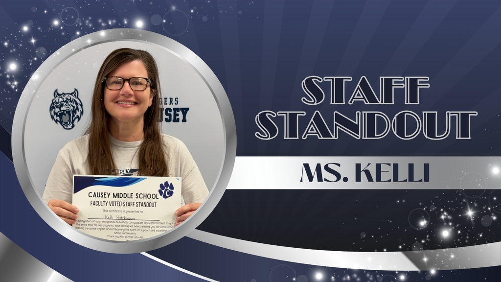 A person holding a certificate with "Staff Standout" text. The certificate is from Carey Middle School.