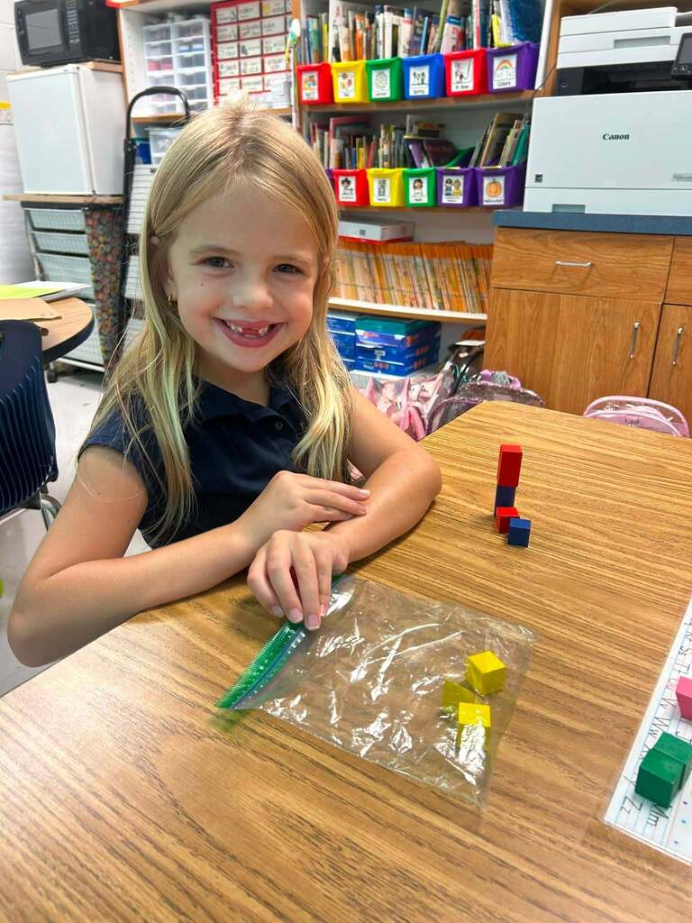 A girl with math manipulatives