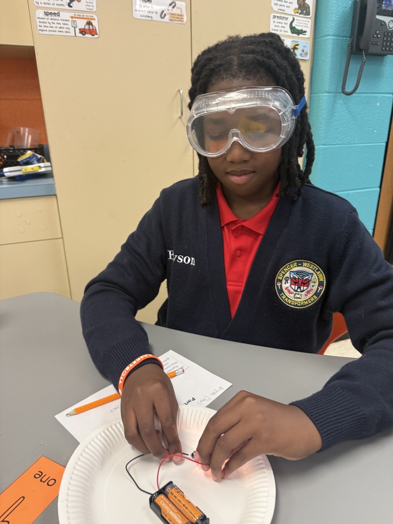 Third, fourth, and fifth grade students learning about closed circuits. 