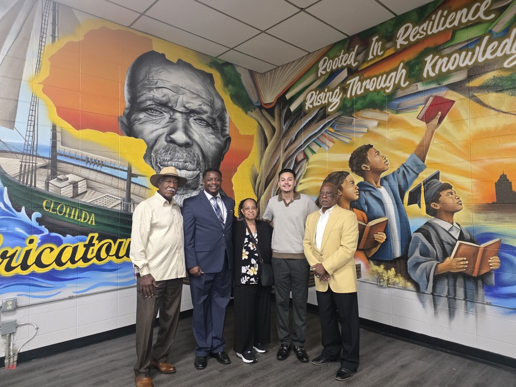 Mobile County Training School officials in front of the mural