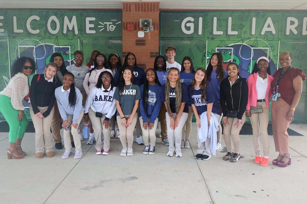 A group of Baker High students standing outside Gilliard Elementary