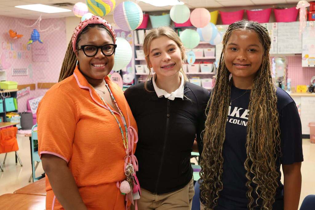 A teacher with two high school students