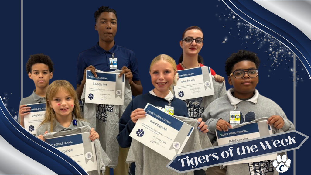 Students pose for a photo holding certificates; background includes blue wave and "Tigers of the Week".