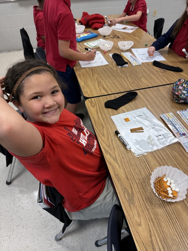 Today we made learning three-digit numbers extra fun! 🔢✨ Ms. Weaver's second graders rolled dice to build a number for each place value on their HTO (Hundreds-Tens-Ones) chart. Then we used Cheez-Its for hundreds, pretzel rods for tens, and marshmallows for ones to build/represent our numbers! 🧀🥨☁️