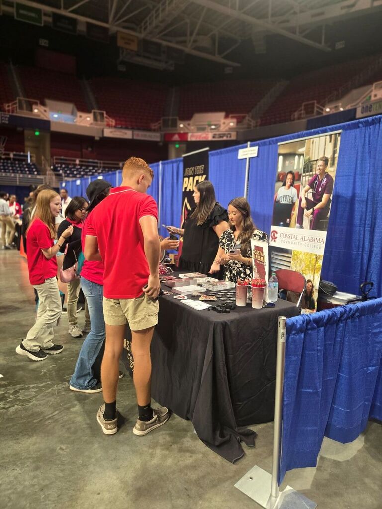Some students talking to the Coastal Alabama Community College representative.