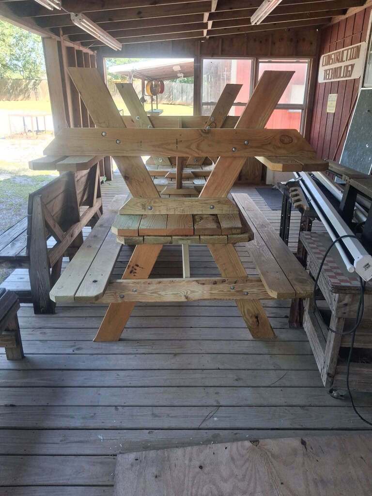 Wooden picnic tables built by the construction students at Bryant Career Tech Center. 