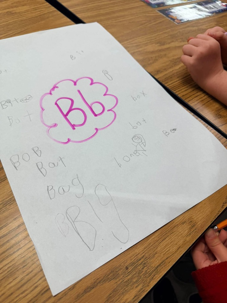 First grade playing freeze and write to review letter sounds and high frequency words: