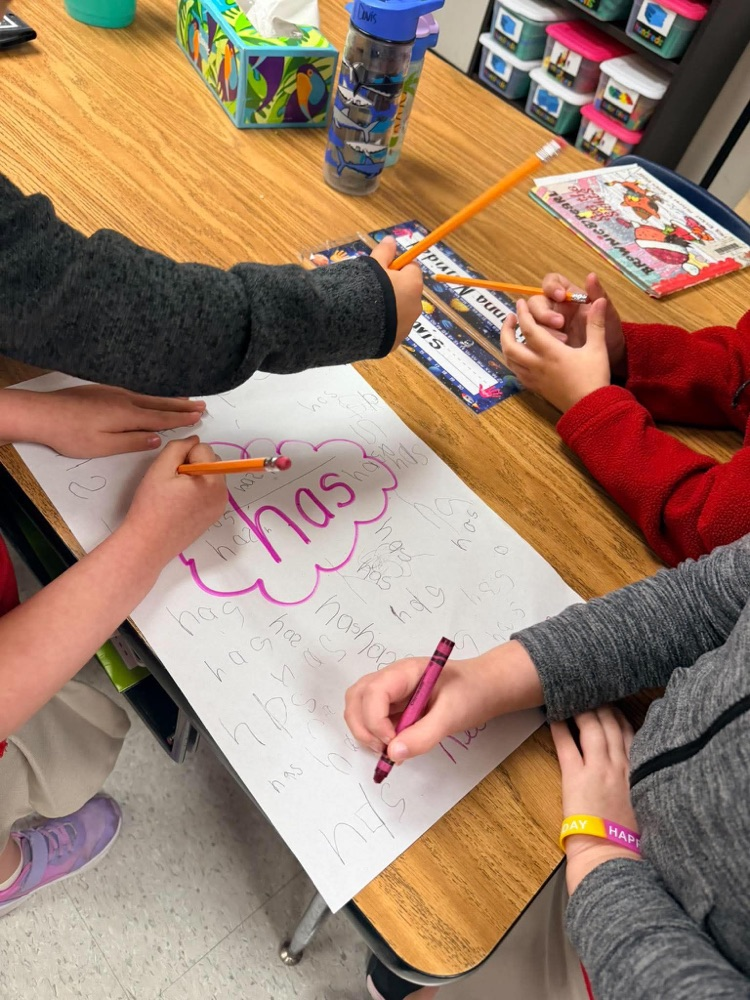 First grade playing freeze and write to review letter sounds and high frequency words: