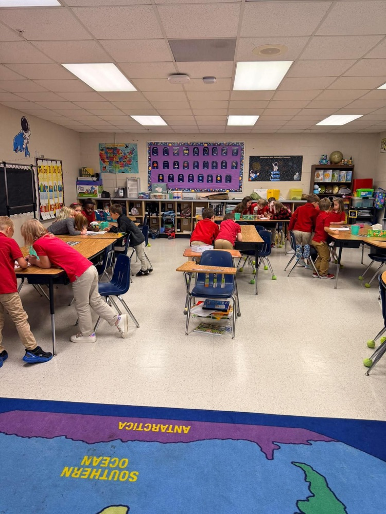 First grade playing freeze and write to review letter sounds and high frequency words:
