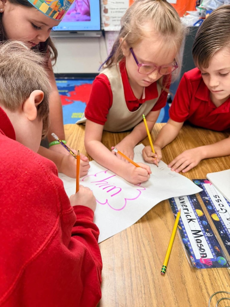 First grade playing freeze and write to review letter sounds and high frequency words: