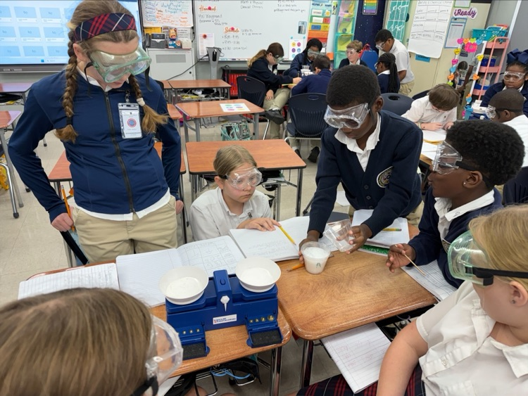 Mrs. Barnes’ fifth-grade students conduct a science experiment by mixing baking soda with a citric acid solution to observe a chemical reaction and learn about the Law of Conservation of Matter.