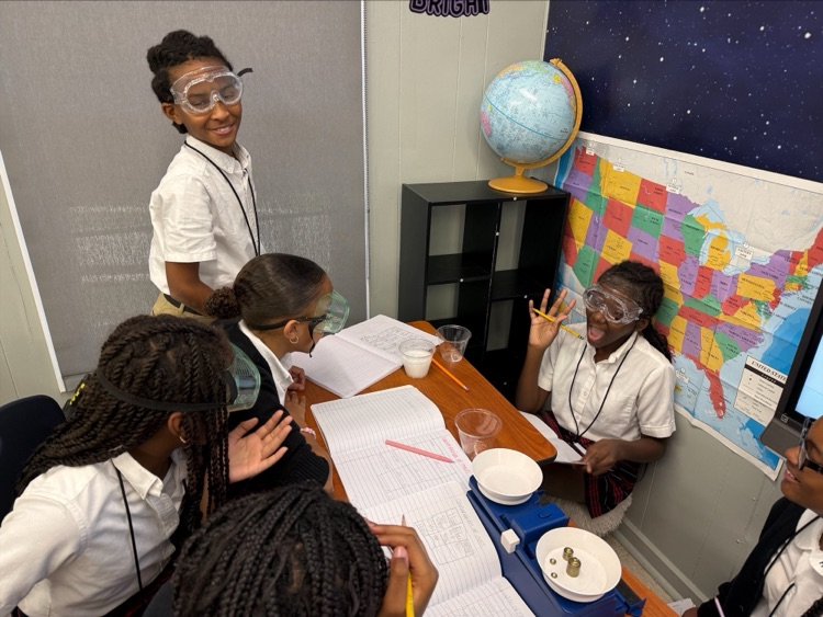 Mrs. Barnes’ fifth-grade students conduct a science experiment by mixing baking soda with a citric acid solution to observe a chemical reaction and learn about the Law of Conservation of Matter.