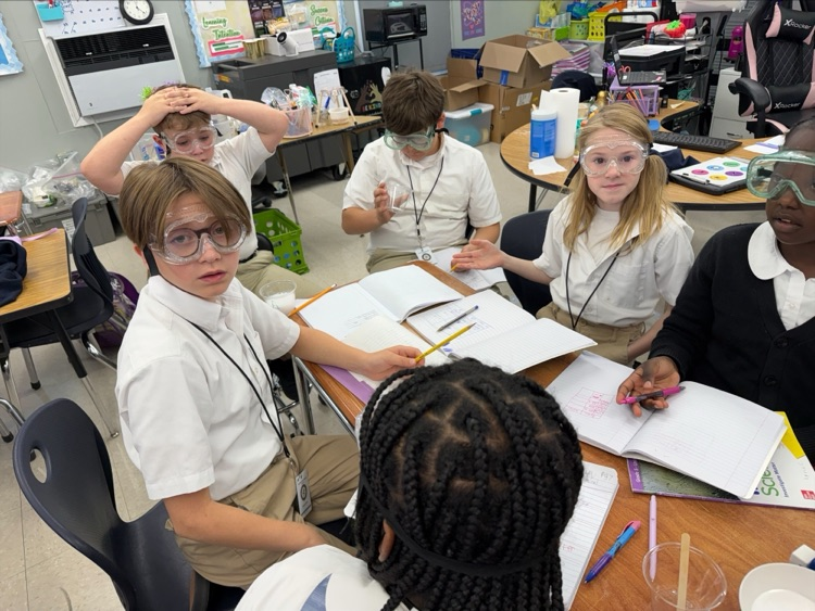 Mrs. Barnes’ fifth-grade students conduct a science experiment by mixing baking soda with a citric acid solution to observe a chemical reaction and learn about the Law of Conservation of Matter.
